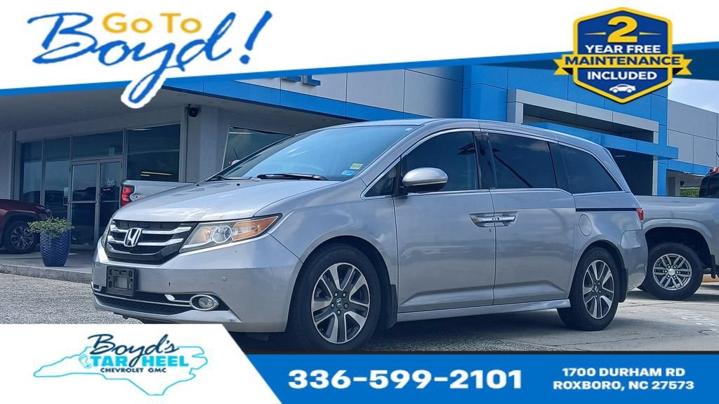 2016 Honda Odyssey Touring Elite in Silver — front three-quarter view